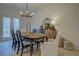 Dining room with natural light, table, and an decorative mirror in the background at 220 Nicklaus Cir, Social Circle, GA 30025