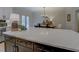 Spacious kitchen island featuring white countertops and dark wood cabinets at 220 Nicklaus Cir, Social Circle, GA 30025