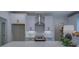 Modern kitchen features white cabinets, gray subway tile backsplash, and island at 220 Nicklaus Cir, Social Circle, GA 30025