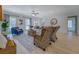 Spacious living room featuring wood floors, fireplace, and comfortable seating at 220 Nicklaus Cir, Social Circle, GA 30025