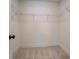Walk-in closet features wall shelving and carpet flooring at 220 Nicklaus Cir, Social Circle, GA 30025
