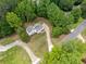 Charming home with manicured lawn and expansive driveway nestled among mature trees at 2920 Alberta Dr, Marietta, GA 30062