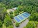 Aerial view of community tennis courts and surrounding lush landscaping at 2920 Alberta Dr, Marietta, GA 30062