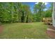 A spacious backyard features a well-maintained lawn and a raised wooden deck at 2920 Alberta Dr, Marietta, GA 30062