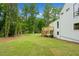A large, green backyard with a white home and wooden deck at 2920 Alberta Dr, Marietta, GA 30062