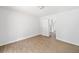 Cozy bedroom with wood floor and white walls, leading to other rooms at 2920 Alberta Dr, Marietta, GA 30062