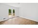 Bright bedroom with a wood floor and glass doors leading to a wooden deck at 2920 Alberta Dr, Marietta, GA 30062