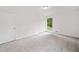 Bright bedroom featuring carpet, a window with a nature view, closet, and neutral paint at 2920 Alberta Dr, Marietta, GA 30062