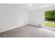 Bright bedroom featuring carpet and a large window offering natural light and views at 2920 Alberta Dr, Marietta, GA 30062