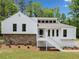 Inviting home with stone accents, white siding, large windows, and a welcoming front porch at 2920 Alberta Dr, Marietta, GA 30062