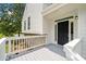 Inviting entrance with black front door, white siding, and lovely grey porch at 2920 Alberta Dr, Marietta, GA 30062