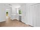 Bright kitchen with white cabinetry, stainless steel dishwasher, and hardwood flooring, plus view to outdoor deck at 2920 Alberta Dr, Marietta, GA 30062