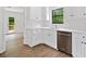 Bright, updated kitchen with white cabinets, stainless dishwasher, and view to the backyard deck at 2920 Alberta Dr, Marietta, GA 30062