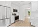 Open kitchen featuring stainless steel appliances, white cabinets, and direct access to a deck area at 2920 Alberta Dr, Marietta, GA 30062