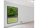 A window with black trim provides natural light and outdoor views in a bright living space at 2920 Alberta Dr, Marietta, GA 30062