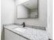 Modern bathroom featuring a speckled granite countertop, white sink, and stylish backsplash at 5857 Earlwane Dr, Lithonia, GA 30058