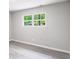 Bedroom featuring wood-look floors and view of trees outside the window at 5857 Earlwane Dr, Lithonia, GA 30058