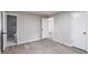 Spacious bedroom with sleek flooring, featuring bathroom doorway to ensuite at 5857 Earlwane Dr, Lithonia, GA 30058