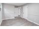 Large bedroom showcasing modern paint, fresh floors, and ample natural light at 5857 Earlwane Dr, Lithonia, GA 30058