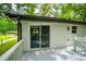 View of the wood deck with white painted rails overlooking a grassy backyard at 5857 Earlwane Dr, Lithonia, GA 30058