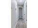 Bright hallway featuring modern flooring and fresh paint at 5857 Earlwane Dr, Lithonia, GA 30058