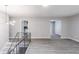 Spacious living area with modern gray walls and access to the kitchen at 5857 Earlwane Dr, Lithonia, GA 30058