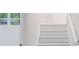 White staircase, natural light from window to exterior, white trim at 5857 Earlwane Dr, Lithonia, GA 30058