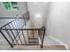 Open staircase with modern metal railings leads to the front door entrance at 5857 Earlwane Dr, Lithonia, GA 30058