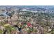 Gorgeous aerial view of a house with a private pond and surrounded by a lush forest, showcasing the lot size at 65 Deer Run Ln, Mcdonough, GA 30252