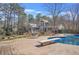 Backyard pool with diving board, lounge chairs, and home in the background, perfect for outdoor living at 65 Deer Run Ln, Mcdonough, GA 30252