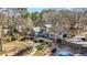 Spacious backyard featuring a large deck, patio area, in-ground pool, and meticulously landscaped grounds at 65 Deer Run Ln, Mcdonough, GA 30252