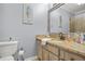 A bathroom featuring granite counters, an under-mount sink, and coastal decor that offers a calming space at 65 Deer Run Ln, Mcdonough, GA 30252