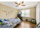Bedroom with hardwood flooring and a large window for natural light at 65 Deer Run Ln, Mcdonough, GA 30252
