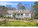 Charming single-Gathering home with stone accents, dormer windows and a beautifully landscaped front yard at 65 Deer Run Ln, Mcdonough, GA 30252