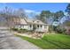 Beautiful home with well-manicured lawn, stone-accented façade, covered porch and extended driveway at 65 Deer Run Ln, Mcdonough, GA 30252