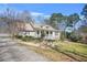 Beautiful home with well-manicured lawn, stone-accented façade, covered porch and extended driveway at 65 Deer Run Ln, Mcdonough, GA 30252