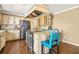 Kitchen featuring an island with granite countertop and seating, stainless steel appliances at 65 Deer Run Ln, Mcdonough, GA 30252