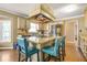 Kitchen featuring a cooking island with granite countertops, bar stool seating, and stainless appliances at 65 Deer Run Ln, Mcdonough, GA 30252