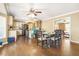 Open kitchen and dining area with stainless steel appliances, island, and hardwood floors at 65 Deer Run Ln, Mcdonough, GA 30252