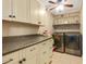 Well-lit laundry room featuring washer and dryer units with upper and lower cabinet space at 65 Deer Run Ln, Mcdonough, GA 30252