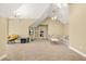 Spacious room with carpet flooring, neutral colors, vaulted ceilings and three ceiling fans at 65 Deer Run Ln, Mcdonough, GA 30252