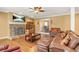 Warm and inviting living room with hardwood floors and a stone fireplace at 65 Deer Run Ln, Mcdonough, GA 30252