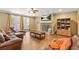 Bright living room with fireplace, built-in shelving, and a comfortable leather sofa at 65 Deer Run Ln, Mcdonough, GA 30252