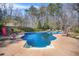 Sparkling in-ground pool with spacious deck and lounge chairs, perfect for relaxation and recreation at 65 Deer Run Ln, Mcdonough, GA 30252