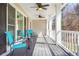 Inviting covered porch featuring bright chairs, ceiling fans, and lots of natural light at 65 Deer Run Ln, Mcdonough, GA 30252