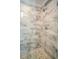 A close up of a shower with stylish tile and stone flooring at 65 Deer Run Ln, Mcdonough, GA 30252