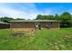 Backyard with spacious lawn leading to the home's back entrance at 87 Virgil Sw St, Mableton, GA 30126