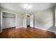 This bright bedroom features hardwood floors, neutral paint, a closet, and white trim at 87 Virgil Sw St, Mableton, GA 30126