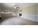 Dining room shows tile floors, a ceiling fan, and an open layout to the kitchen at 87 Virgil Sw St, Mableton, GA 30126