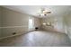 Open dining area features tile flooring, neutral walls, a ceiling fan, and access to the kitchen at 87 Virgil Sw St, Mableton, GA 30126